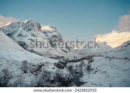 Two snow-covered peaks of the Three Sisters mountains in Glencoe, Scottish highlands