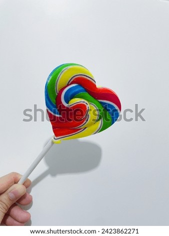 The heart-shaped lollipop is a sweet and iconic representation of love.