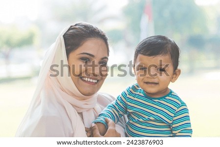 Mother and baby son lifestyle moments in Dubai. Young woman with her kid outdoor. Family concepts in the UAE