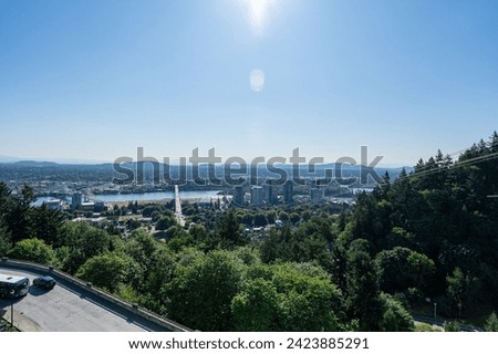 A photo of the Portland Skyline and Mt. Hood in the background on a clear sunny summer day as viewed from the Oregon Health and Science University.