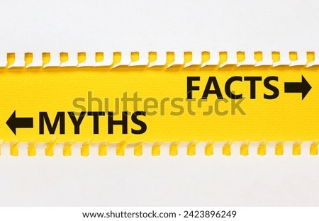 Facts or myths symbol. Concept word Myths and Facts on beautiful yellow paper. Beautiful white paper background. Business and facts or myths fact myth concept. Copy space. Royalty-Free Stock Photo #2423896249