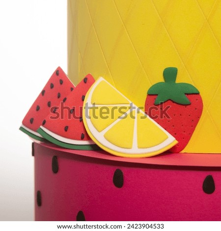 Cakes with wafer paper with lemon, orange, strawberry, cherries, mandarins and ananas. Cake decoration with orange jelly sauce and orange. Modern wafer paper cakes