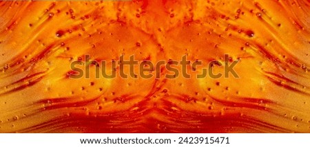 Abstract mother-of-pearl background in red with a golden sheen. The texture of the liquid is red-orange. the banner.