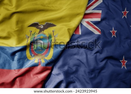 big waving national colorful flag of new zealand and national flag of ecuador . macro