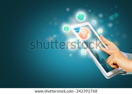 Close up of human hand touching screen of tablet