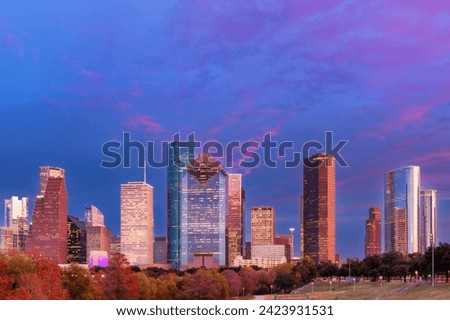 Houston City skyline at pink sunset in Houston, Texas, USA.