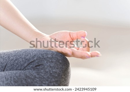 Hands of a meditating woman