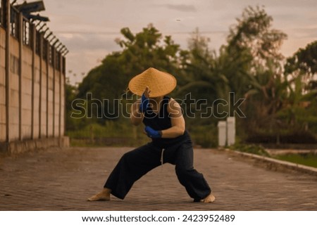 Indonesian martial arts techniques “silat” Royalty-Free Stock Photo #2423952489