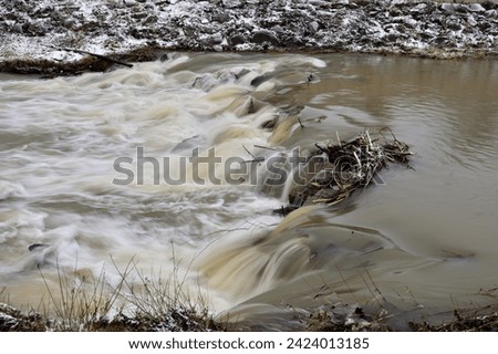 Long exposured scenery natural river with small waterfall landscape
