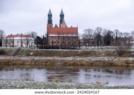 View on Poznan Cathedral - Archcathedral Basilica of St. Peter and St. Paul from the Warta river. Poland