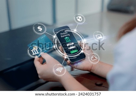 Mobile online banking concept.Close-up of Female hands using mobile phone and holding credit card Royalty-Free Stock Photo #2424031757