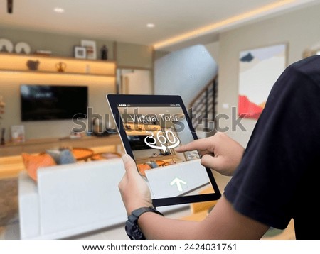 Virtual tour 360 for real estate technology concept.Man hands holding digital tablet Royalty-Free Stock Photo #2424031761