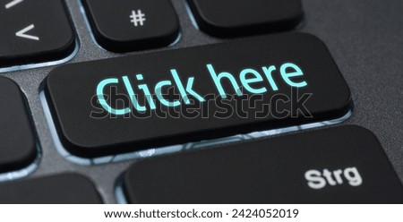 Illuminated keyboard with a labeled key - Click here Royalty-Free Stock Photo #2424052019