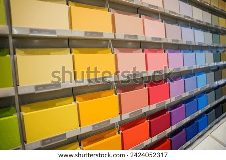Stand of paint samples for wall painting at the shop