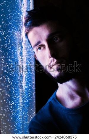 man looking at the galaxy, photo of a model for advertising, blue photo with special effects