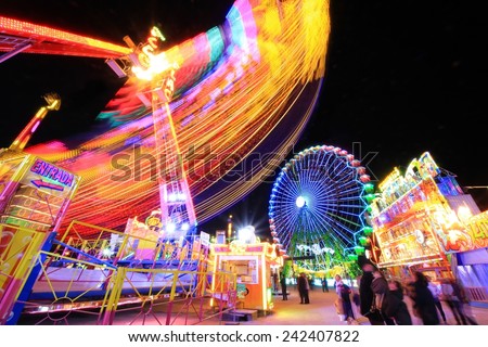 Abstract blurry light background with long exposure picture of a carrusel rotating during the christmas fair in Alicante, Spain