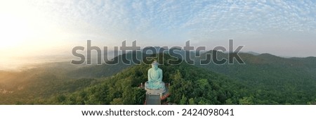 Panorama view of the great buddha at doi phra chan towering bronze Buddha statue that can be reached by climbing 628 steps up at wat Prathat Doi Prachan, Pa Tan, Mae Tha District, Lampang, Thailand