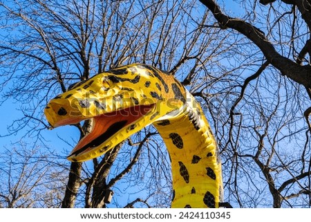 A figure in the shape of a large snake decorates the gardens.