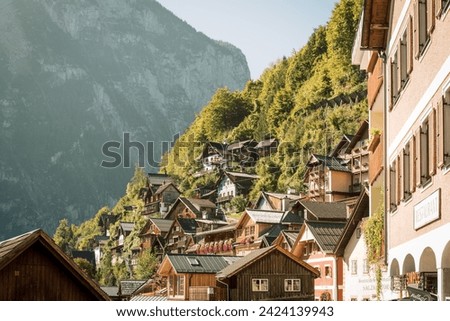 Hallstatt's picturesque mountain homes bask in the alpine sun, reflecting Austria's rustic beauty