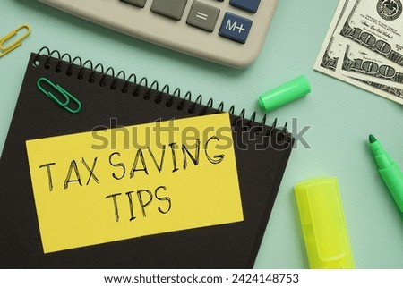 Tax saving tips are shown using a text Royalty-Free Stock Photo #2424148753