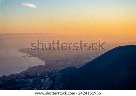 Sunset over Mediterranean sea  and Fuengirola from Calamorro peak, Costa del Sol, Andalusia, Spain Royalty-Free Stock Photo #2424151955