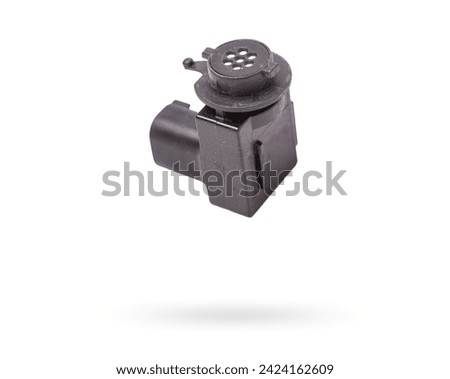 Close-up of a spare part for an air quality sensor car for replacement during repair or for sale at an auto-parsing. Royalty-Free Stock Photo #2424162609