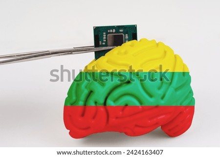 On a white background, a model of the brain with a picture of a flag - Lithuania, a microcircuit, a processor, is implanted into it. Close-up