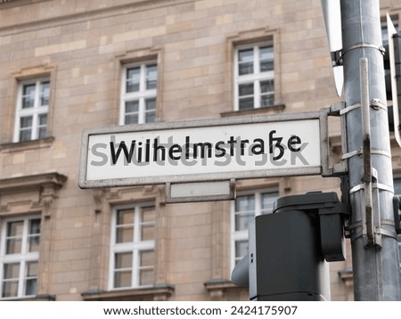 Wilhelmstraße (Wilhelm Street) in Berlin. Sign with the road name at an intersection. The location is popular for a lot of government and ministry buildings in the city.