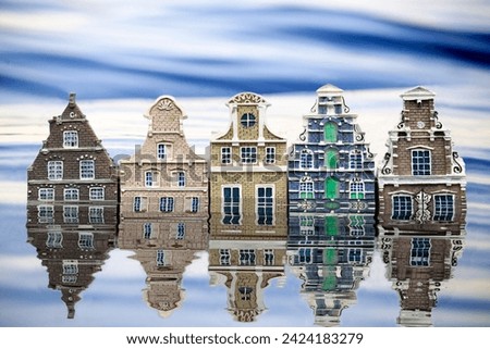 Graphic image of partly submerged houses whose structure resembles the historic Dutch - styled architecture