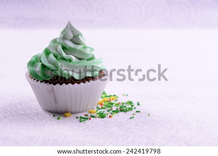 Delicious cupcake on table close-up