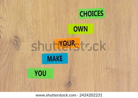 You make your own choice symbol. Concept words You make your own choice on colored paper. Beautiful wooden background. Business you make your own choice concept. Copy space.