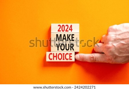 2024 Make your choice symbol. Concept words 2024 Make your choice on beautiful wooden block. Beautiful orange table orange background. Voter hand. Business 2024 Make your choice concept. Copy space.