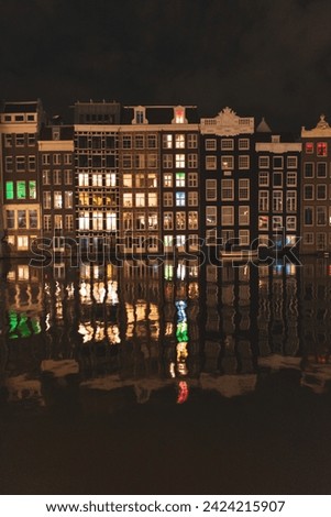 Amsterdam skyline with reflections on water