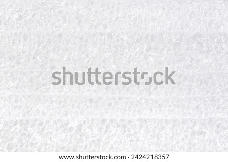 Close-up view of white packaging polyurethane foam material structure high resolution background texture up close, backdrop simple protective material for shipping and handling abstract concept nobody