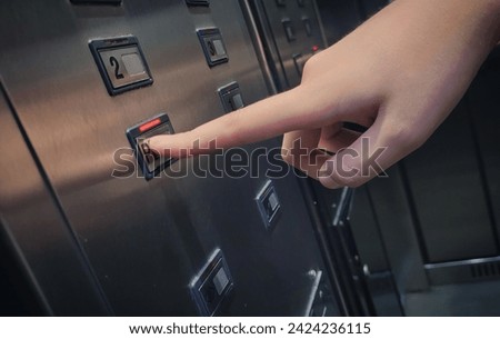 Hand holding Button - Decissions (elevator)