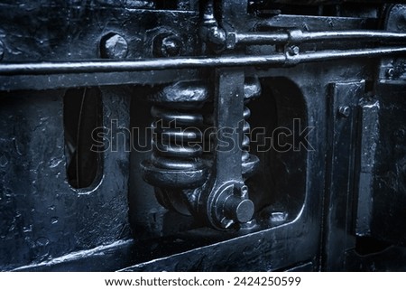 A durable electric locomotive made of metal parts Royalty-Free Stock Photo #2424250599