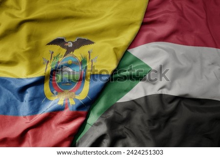 big waving national colorful flag of sudan and national flag of ecuador . macro