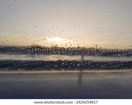 drops on the window of a moving car