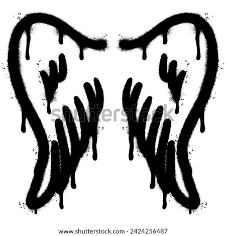 Spray Painted Graffiti wings Sprayed isolated with a white background.