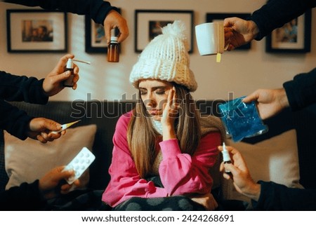 
Woman Receiving Care and Multiple Flue Remedies at Home. Unhappy unwell girl suffering from grippe trying all the treatments 
 Royalty-Free Stock Photo #2424268691