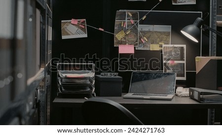 Empty incident room with criminal case investigation, board with clues and evidence. Suspicious research photos and file folders on racks, federal confidential documents in agency office. Royalty-Free Stock Photo #2424271763