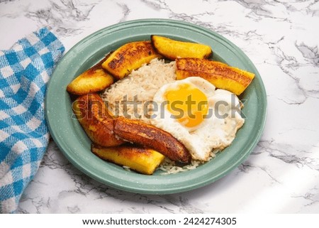 iconic Cuban dish with rice, fried plantain, and eggs.
