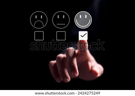 Person choosing check mark on customer service evaluation form. Rate satisfaction by smiling face.