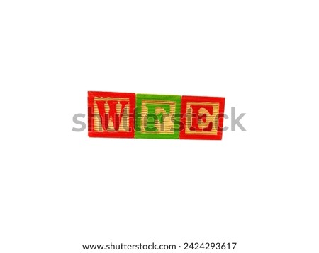 The term "WFE" is arranged with wooden blocks horizontally. The picture was taken on a white background.