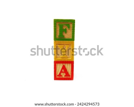 The term "FYA" is arranged with wooden blocks vertically. The picture was taken on a white background.