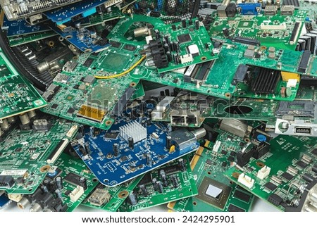 Electronic waste of mainboard computer - old TV circuit boards from recycle industry Royalty-Free Stock Photo #2424295901