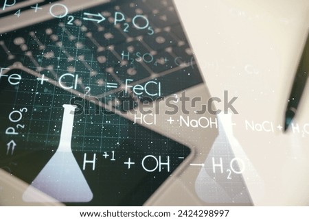 Creative chemistry hologram on modern laptop background, pharmaceutical research concept. Multiexposure