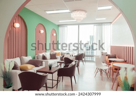 Empty stylish and modern office interior with skyscrapers view decorated with table, chair, botany decoration, elegant accessory. Living room. Modern interior. Creative design. Day light. Ornamented. Royalty-Free Stock Photo #2424307999