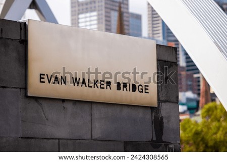 Evan Walker Bridge sign in Southbank, Australia. Evan Walker was an Australian architect who played a significant role in shaping Melbourne's architectural landscape during the mid-20th century.