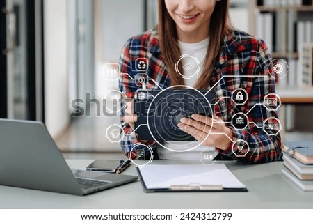 Businesswoman hand working digital marketing media in virtual screen with mobile phone and modern compute with VR icon diagram at office